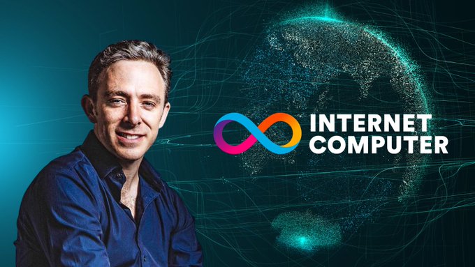 The image features a man wearing a blue shirt, sitting next to an advertisement for "Internet Computer". The man has his arms crossed over his chest as he smiles at the camera. The background of the image is a dark blue color with white text that reads "ICP @dominic_w".