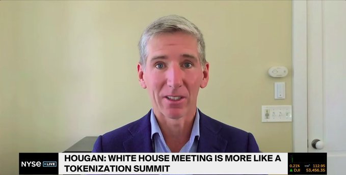 A man in a navy blazer speaks during an NYSE Live broadcast, with on-screen text reading "HOUGAN: WHITE HOUSE MEETING IS MORE LIKE A TOKENIZATION SUMMIT" alongside DJI ticker numbers (112.95 and 53,456.35) and a 0.21% indicator. The image shows Matt Hogan delivering his commentary about the White House meeting being effectively a tokenization summit.