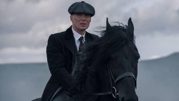 A man in a flat cap and dark suit rides a black horse across an overcast landscape, evoking a somber, old-world tone that contrasts with the modern crypto market turbulence described in the accompanying post.