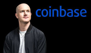 An image of Coinbase CEO Brian Armstrong in a gray shirt and black jacket against a black background with the blue 'coinbase' logo.