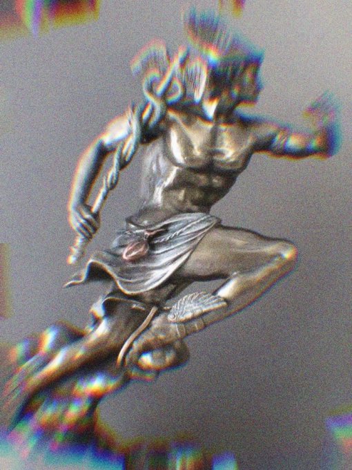 The image features a silver statue of a man, likely a deity or a hero from Greek mythology, depicted in mid-jump with one foot raised while holding a staff. The background appears to be gray, which contrasts with the shiny silver color of the statue. The caption " Hermes We Trust" is written below the statue, suggesting that it represents the Greek messenger god Hermes and his association with trust and swiftness.