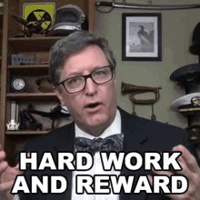 The image features a man wearing glasses, a suit, and a bow tie giving a speech or presentation with the caption "Hard work and reward" written above him. The text also mentions Silk Suites and how people can earn money by promoting their content on the platform.