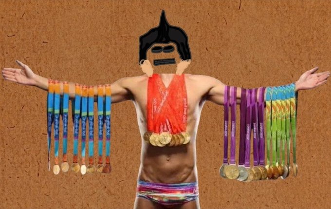 The image features a man standing against a brown background, wearing only his underwear and holding an assortment of gold and silver medals around his neck. The man's face has been altered with a black mask, giving him a unique appearance that resembles a gorilla or a robot. The post includes a link to the original image on Twitter, encouraging people to follow @thedumbois for more information about entering the contest or liking the post.