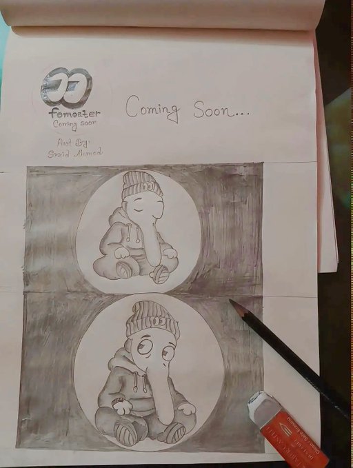 A sketchbook page features two pencil drawings of an elephant character wearing a beanie and hoodie, with a 'Tomoroter Coming Soon' logo and the handwritten text 'Coming Soon...' at the top.