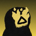 A pixelated, low-resolution image shows a dark hooded figure with yellow facial markings on a muted gray background.