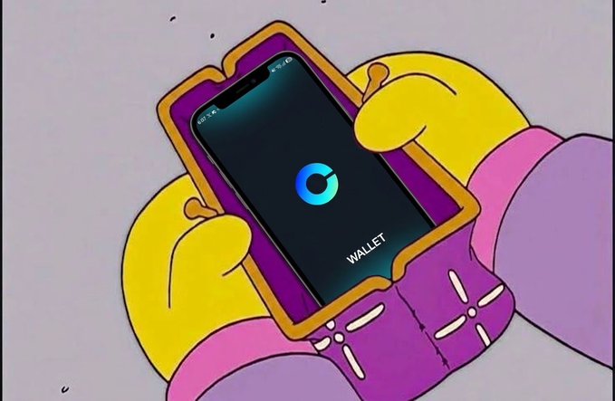 A Simpsons-style cartoon illustration showing yellow hands holding a smartphone displaying a crypto wallet app with a 'C' logo and the word 'WALLET' on screen.