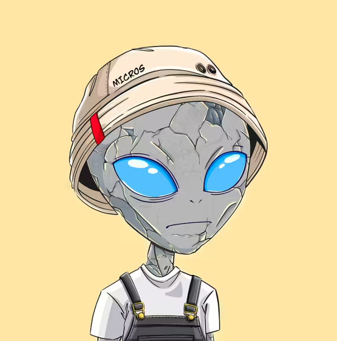A cartoon illustration of a grey stone-textured alien with large blue eyes wearing a beige beanie labeled "NICROS", a white shirt, and dark overalls.