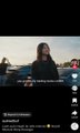 A blurry TikTok video shows a woman in a black hoodie standing outdoors near a car, with a caption overlay reading "actually feeling miserable" while the caption beneath the post mocks the "sushi" TikTok handle for allegedly disguising a Discord scam to steal deposits.