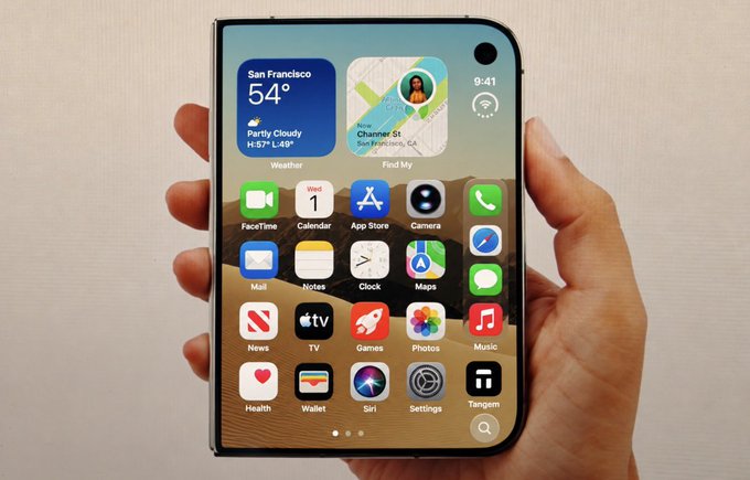 A hand holds a foldable smartphone displaying the iOS home screen with widgets showing San Francisco weather (54°, partly cloudy), time 9:41, and various app icons including FaceTime, Calendar, App Store, Camera, Mail, Notes, Clock, Maps, Messages, News, TV, Games, Photos, Music, Health, Wallet, Siri, Settings, and Tangem.