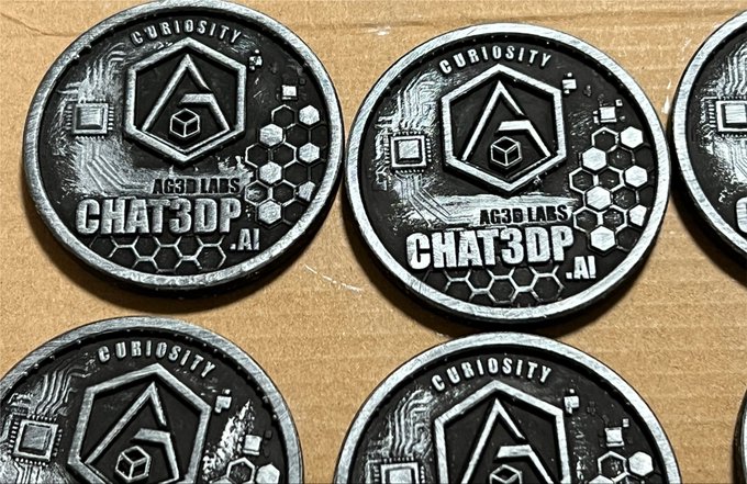Several black and silver metallic coins are arranged on a wooden surface, featuring the text "CURIOSITY," "AC3D LABS," and "CHAT3DP.AI," along with geometric designs including a cube inside a hexagon and circuit board patterns. The coins appear to be custom 3D-printed promotional pieces, fitting with the post's request to showcase collectible coins.