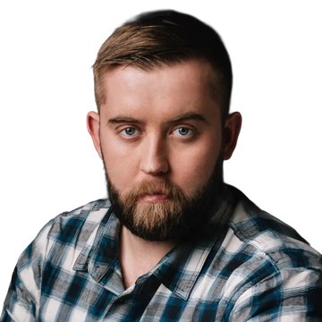 A portrait of a bearded man in a blue plaid shirt who appears to be Sergey Nazarov, the co-founder of Chainlink, shown as the context for the news about record institutional interest in Chainlink's ($LINK) infrastructure for tokenized assets and blockchain systems.