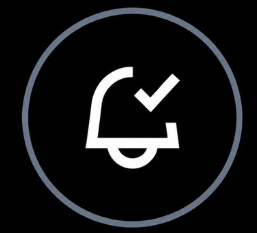 A simple notification bell icon with a checkmark inside a gray circle, symbolizing an alert or announcement. It visually represents the "important announcement" teased in the post about Monad.