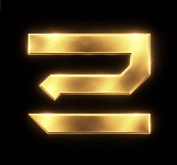 A glowing, metallic gold geometric logo resembling a stylized number "3" or abstract letter against a dark background.