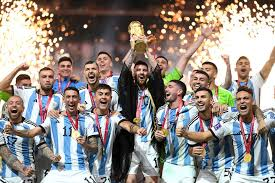 ursa de la tierra soccer team celebrates their victory, holding a trophy and surrounded by teammates on the field.