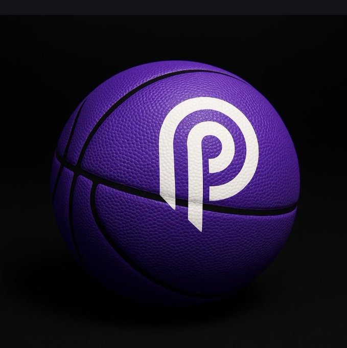 The image features a purple basketball with white text that reads "Pyth @PythNetwork" written on it. The basketball is placed against a black background, making it stand out prominently. The caption below the image provides information about the basketball and its connection to the Pyth Network.