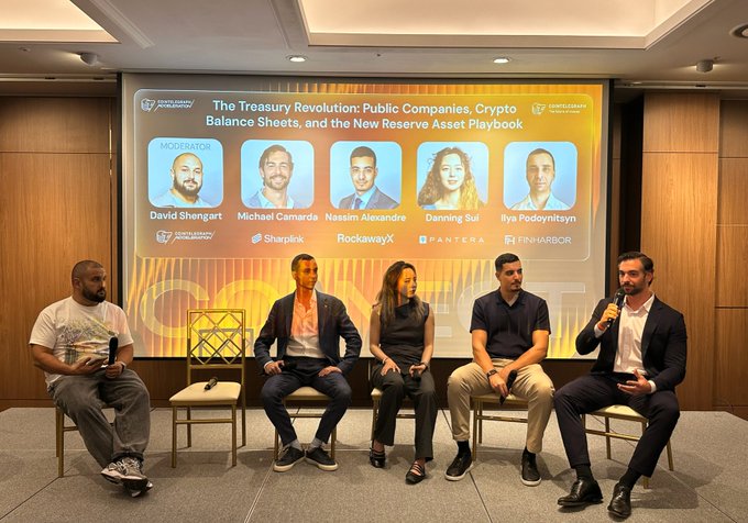 A panel discussion titled "The Treasury Revolution: Public Companies, Crypto Balance Sheets, and the New Reserve Asset Playbook" features speakers including moderator David Shenhart and panelists Michael Camarda (Sharplink), Nasim Alexandre (RockawayX), Danning Sui (Pantera), and Ilya Podolyants (FInnHabor), with Camarda pictured speaking into a microphone about his firm's unique fixed cost structure and Ethereum staking rate at the Cointelegraph Connect event in Seoul.
