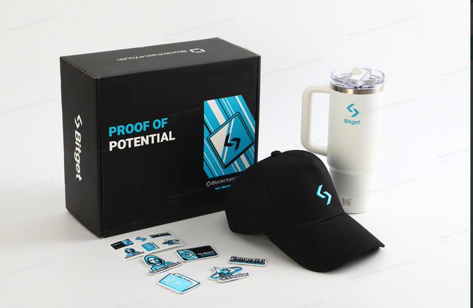 A Bitget promotional merchandise box labeled 'PROOF OF POTENTIAL' containing a branded mug, cap, and stickers.