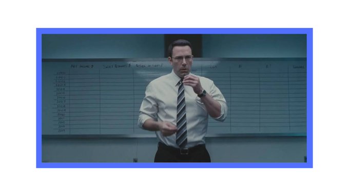The image shows a man in a white shirt and tie standing in front of a whiteboard with handwritten notes about sales bonuses and tier rewards, suggesting a workplace or business meeting setting. 

The image appears to relate to the post about freelancers managing international payments and remittances, possibly representing a businessman or someone involved in financial transactions and earnings tracking.