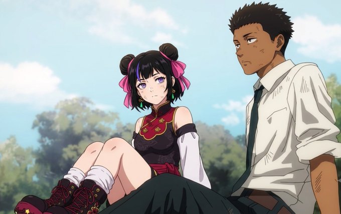 An anime-style illustration showing a girl with black hair in buns and a red and black dress sitting next to a tall boy in a white shirt and tie.