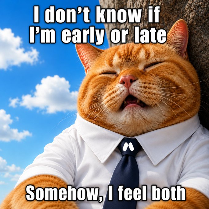 An orange tabby cat wearing a white dress shirt and navy tie appears blissfully content with closed eyes, overlaid with the meme text "I don't know if I'm early or late" at the top and "Somehow, I feel both" at the bottom. The image humorously captures the post's sentiment about being caught between buying and selling in the market—the cat's relaxed, almost zen expression perfectly embodies the confused yet accepting mood of an investor unsure whether to enter or exit a position.