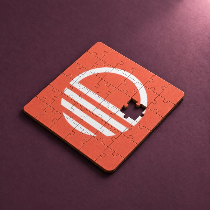 A 3D render of a red square puzzle with a white circular logo, where one puzzle piece is missing, sitting on a dark purple surface.