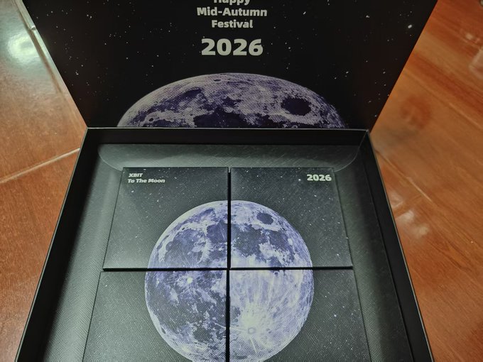 An open gift box for the Trappy Mid-Autumn Festival 2026, featuring XRPT 'To The Moon' cards arranged into a four-piece moon design.