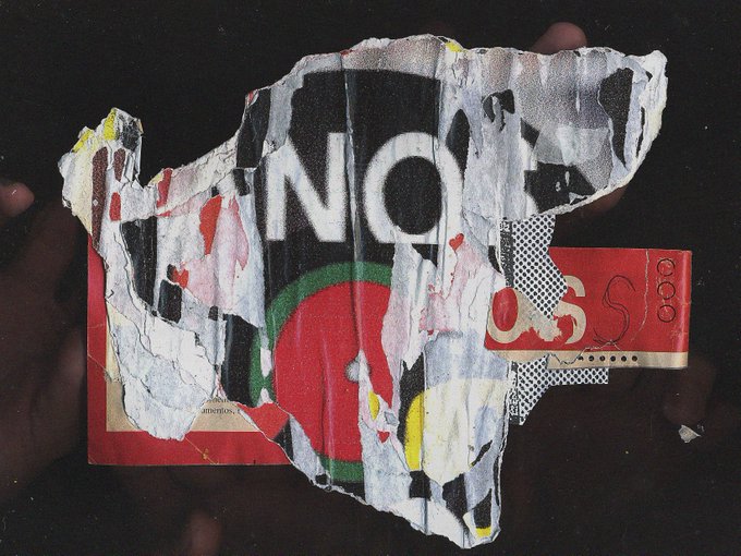 A torn, layered piece of paper with the word 'NO!' printed on it, along with red and black shapes, held by hands against a dark background.