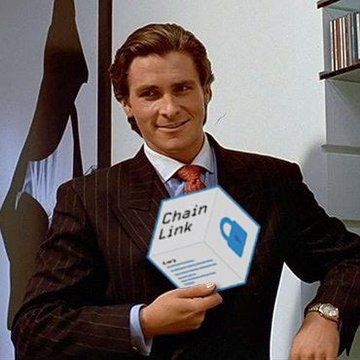 A man in a pinstripe suit holding up a pentagonal sign that reads 'ChainLink' with a blue logo, set in what appears to be an office environment.