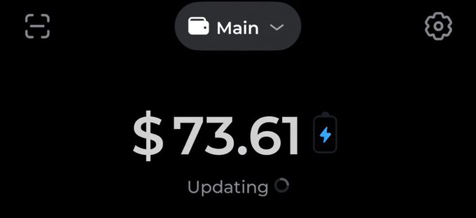 A digital wallet displays a balance of $73.61 with "Updating" status shown, suggesting the earnings are nearly at the $70 daily goal referenced in the caption. The "Main" account label and loading indicator show the funds are actively refreshing, tying into the theme of earning $70 a day through this payment platform.