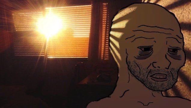 The image features a man with a beard looking sad, sitting next to a window that has blinds covering it. The background of the image shows a sunset or sunrise, which adds an atmospheric element to the scene. There are no texts present in the image, and the focus is primarily on the man's facial expression and his surroundings.
