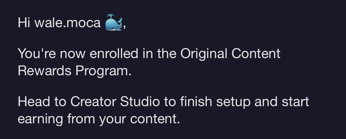 A notification message that reads: "Hi wale.moca 🐳, You're now enrolled in the Original Content Rewards Program. Head to Creator Studio to finish setup and start earning from your content."