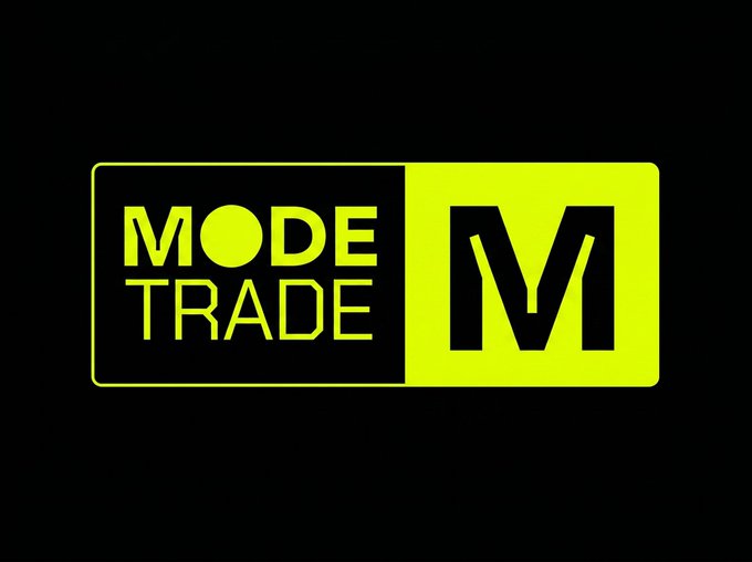 The image features the Mode Trade logo, displaying "MODE TRADE" in yellow text on a black background alongside a stylized black "M" on a yellow panel. The logo visually reinforces the platform's brand identity as an all-in-one trading hub offering crypto, commodities, and leveraged pairs with AI-driven execution.