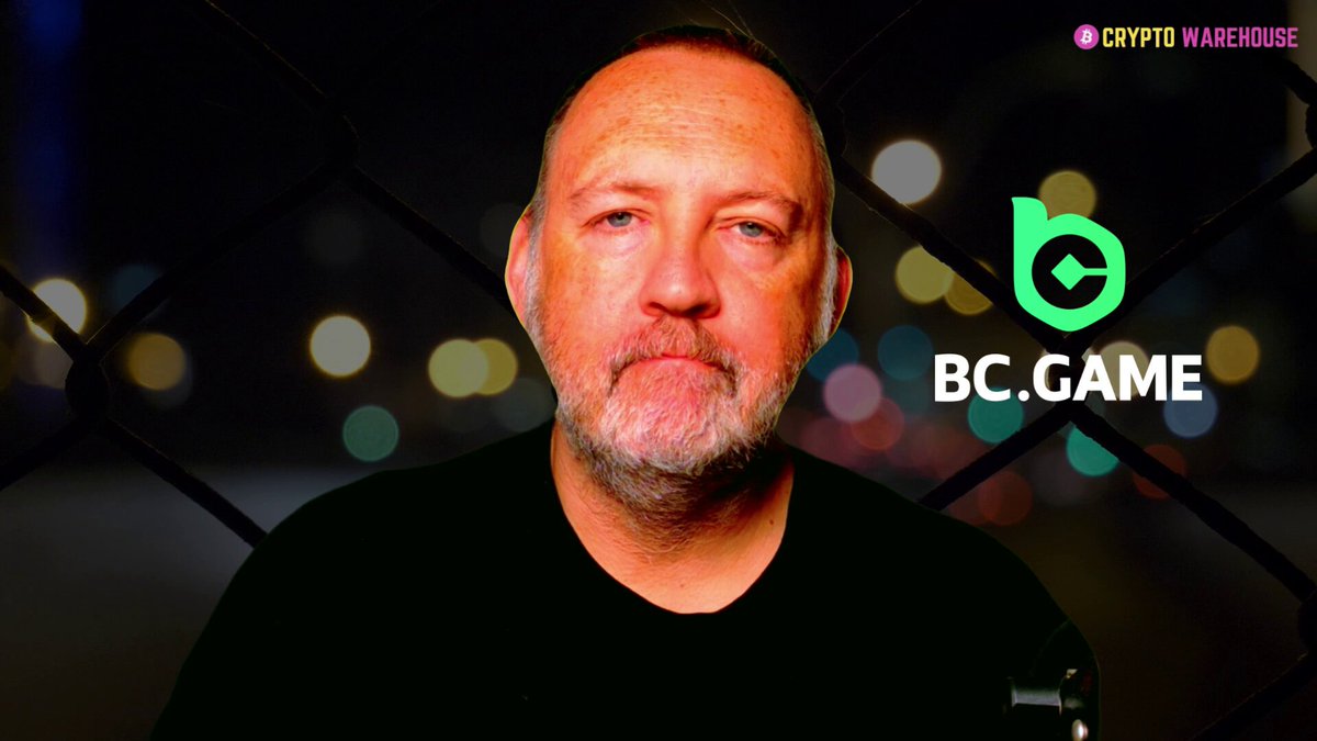 The image features an older man with a beard wearing a black shirt, standing against a dark background that includes a chain link fence and neon lights. The man appears to be looking directly at the camera, giving off a serious expression. In front of him is a banner or sign that reads "@BCEngineX" in green text, which is related to the post about the @BCGame project.