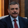 A man in a dark suit with a red tie and a mustache, likely a public figure, poses for a formal portrait. The post references the "0.04% slice," a statistic that may relate to a small group or elite segment associated with the pictured individual.
