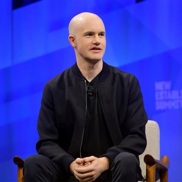 Brian Armstrong, CEO of Coinbase, sits on stage at the New Establishment Summit, likely delivering his bullish prediction that Bitcoin could reach $300,000–$400,000 by 2030.