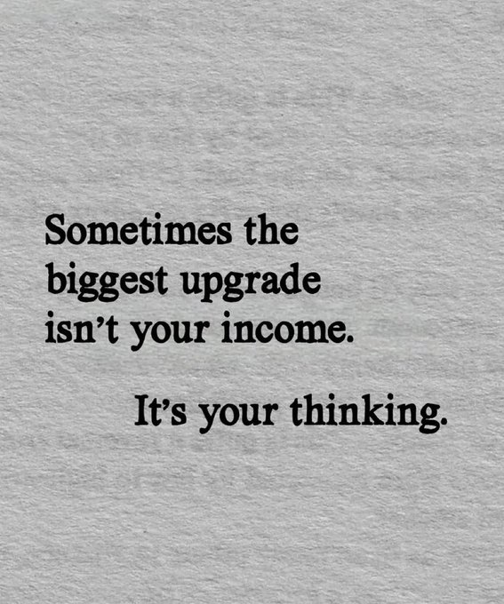 A motivational quote on a gray textured background that reads: "Sometimes the biggest upgrade isn't your income. It's your thinking."