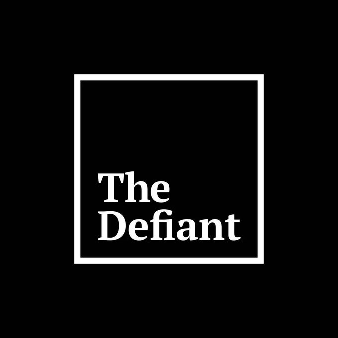 The image features a logo for "The Defiant" company that is black and white. The logo consists of a square with the word "Defiant" written inside, surrounded by a thin line. Below the logo, there are some text elements related to the company's name or mission statement.