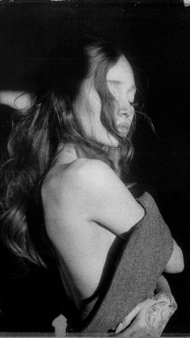 The image features Ariana Grande, though it is partially obscured or stylized in a way that does not clearly show her face. This connects to the post, which discusses the odds of her new release "Petal" achieving first-week sales surpassing her previous record set by "thank u, next."