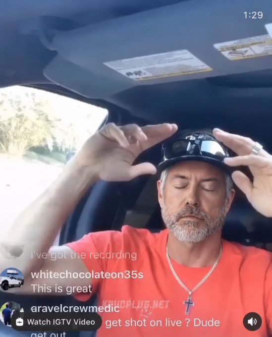 The image shows a man wearing an orange shirt adjusting his sunglasses while sitting inside a car. The caption of the image includes a link to a video that says "I've got the recording Whitechocolate35s. This is great".
