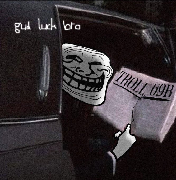 A Troll face meme holds a document labeled "TROLL 69B" next to a black car with "gud luck bro" scrawled in white, symbolizing the post's warning that a multi-billion dollar troll event for the $TROLL ticker is inevitable.
