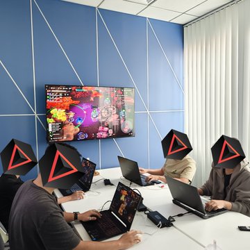 A group of people work on laptops around a conference table with their faces obscured by black geometric logos, while a large screen on the wall displays "SIPHER WORLD" featuring vibrant game artwork, reflecting a focused weekend development session for the Sipher PC project.