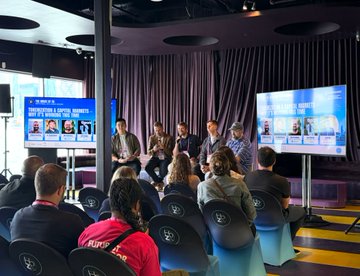 A panel discussion takes place at House of ZK during the Futurist Conference, featuring speakers from Zircuit, zkSync, Arbitrum, TheoriqAI, and The Block, focused on tokenization and capital markets, with "HOW IS TOKENIZATION EVOLVING IN TODAY'S MARKET?" displayed on the screen behind them.