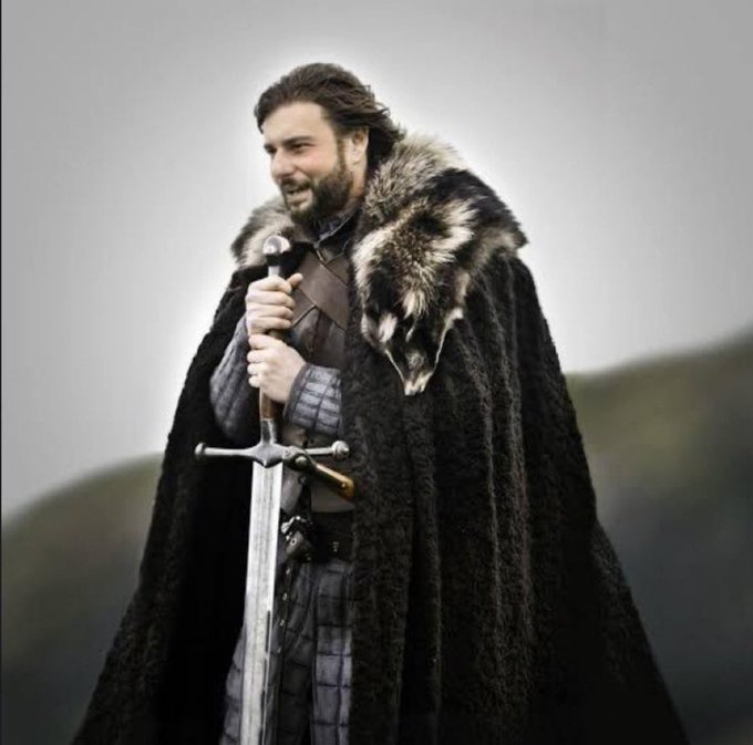 A bearded warrior with long hair grips a sword, draped in a fur-collared black cloak, standing in a misty landscape. The image evokes a "Winter is coming" or battle-ready moment, humorously paired with the caption's boast about making "retards" rich again — framing the poster as a fearless conqueror charging into the markets.