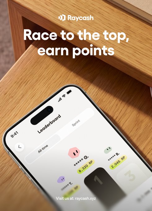 A smartphone on a wooden surface displays the Raycash Leaderboard app with a Sprint tab showing ranked users, including G. at 8.320 RIP in 1st place and B. at 2.045 RIP in 2nd, under the headline "Race to the top, earn points." The image illustrates the post's message about climbing the leaderboard by completing tasks, as users compete for the top position by accumulating RIP points.