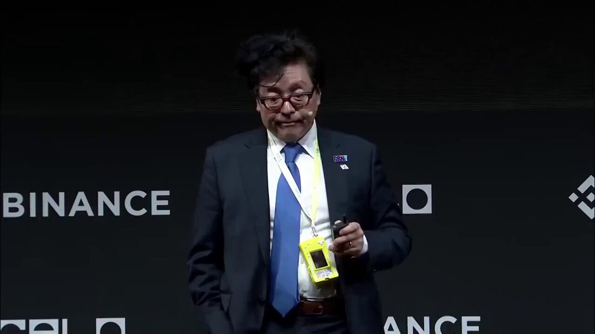 The image features a man wearing glasses, a suit, and a tie standing against a black background with white text. The man has a badge around his neck that says "BREAKING BIONANCE" and he holds up an item of value for sale. The caption reads "#BREAKING BIONANCE TOM LEE PREDICTS $ETH WILL REACH 62,000 DOLLARS YOU'RE NOT BULLISH ENOUGH BUYING ETH NOW IS LIKE BUYING BTC IN 2014 GET READY ETHEREUM WILL MELT FACES".