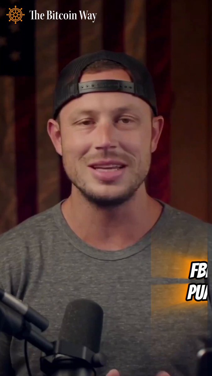 In the image, there's an interview with a man wearing a gray shirt and a black baseball cap. He is holding a microphone and appears to be speaking into it. The background of the image features a flag or banner that says "The Bitcoin Way". There are also some text elements in the image, including "FB PU", which could possibly be related to the interview topic or the post's content.