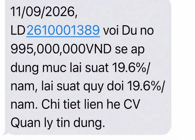 A Vietnamese-language SMS notification about a loan with ID '2610001389' for 995,000,000 VND at a 19.6% annual interest rate, dated 11/09/2026.