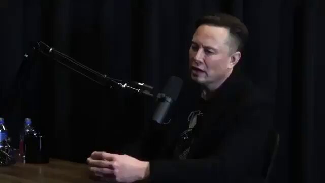 The image features a man sitting at a table with a microphone, suggesting that he might be hosting or participating in an interview or podcast discussion. The focus of the image is on the man's face as he speaks into the microphone, which indicates that this could be a conversation about Bitcoin and its impact on society. The post also mentions that Nick Szabo is responsible for ideas behind Bitcoin, implying that his opinions and insights might be relevant to the topic being discussed in the image.