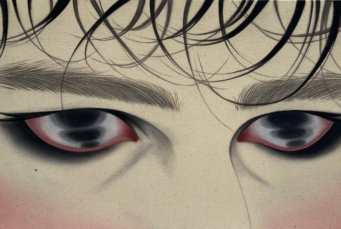 A close-up digital illustration shows a character's face with dark messy hair, furrowed brows, and intense red-rimmed eyes with dark pupils, conveying an angry or distressed emotion.