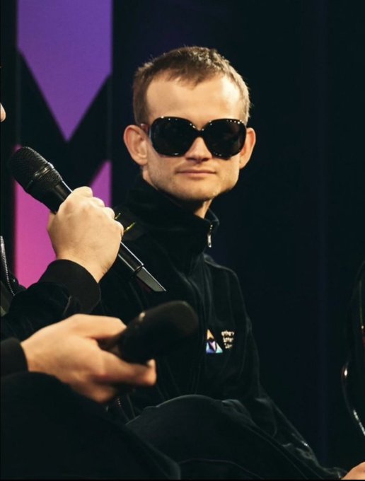 The image features a man wearing sunglasses and holding a microphone while sitting down. The caption reads "Who are the best ethereum privacy follows and what is the definitive privacy thesis, meme and movement for eth?". This suggests that the man might be discussing or promoting the importance of privacy in the context of Ethereum, which is a popular cryptocurrency platform known for its focus on data privacy and security.

The image also includes a purple background with a logo at the top left corner. The caption reads "What is the definitive privacy thesis, meme and movement for eth?". This implies that there might be a specific event or project related to Ethereum's privacy features, such as a conference or an article about the importance of data privacy in the cryptocurrency world.